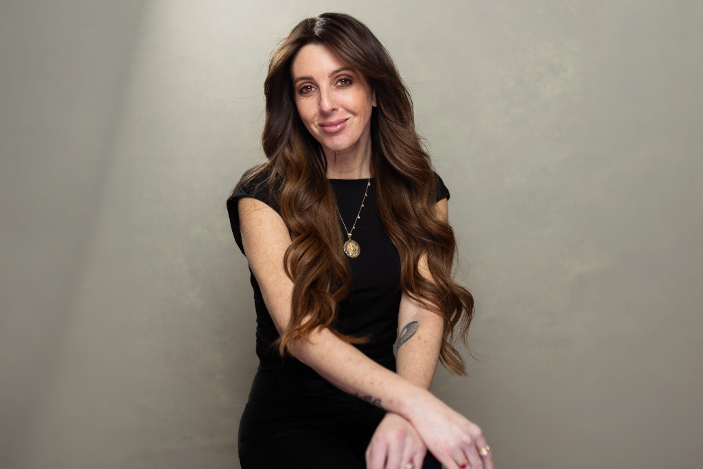 Michelle in elegant seated pose wearing Mixie Mane extensions